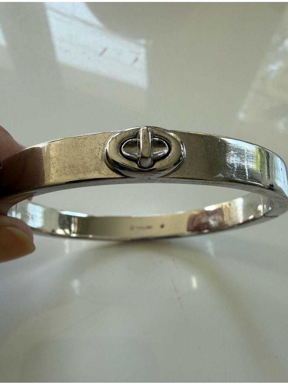 Coach sterling silver plated turnlock closure bracelet